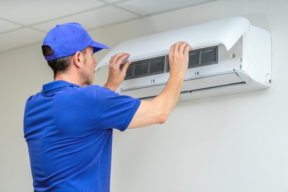 Expert technician from Cool Jay’s Air Conditioning installing an efficient ductless mini split system in a Bakersfield home, optimizing for energy savings